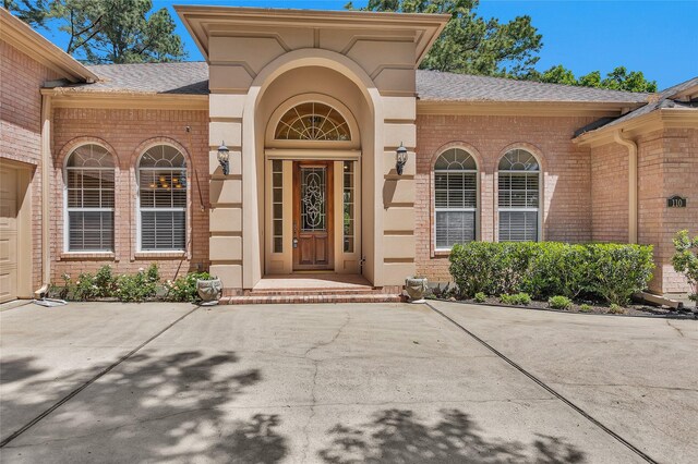 110 Wick Willow Dr, Montgomery, TX 77356 - property entrance with a shingled roof and brick siding