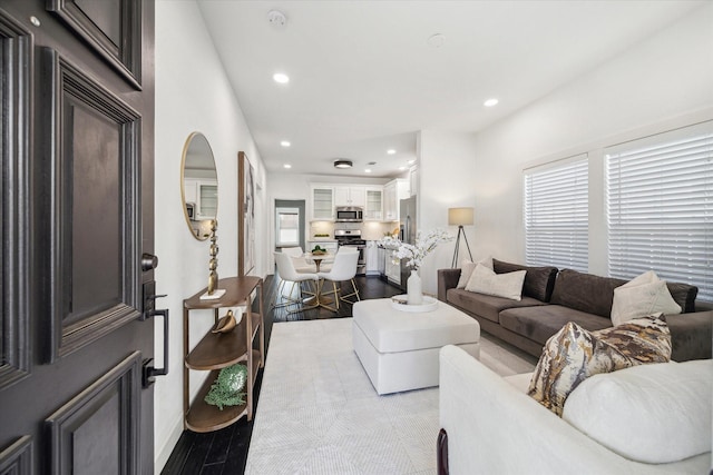 1505 Bonner St, Houston, TX 77007 - living room featuring recessed lighting, dark wood-type flooring, and baseboards