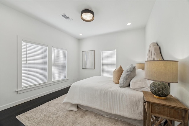 1505 Bonner St, Houston, TX 77007 - bedroom featuring recessed lighting, visible vents, baseboards, and wood finished floors