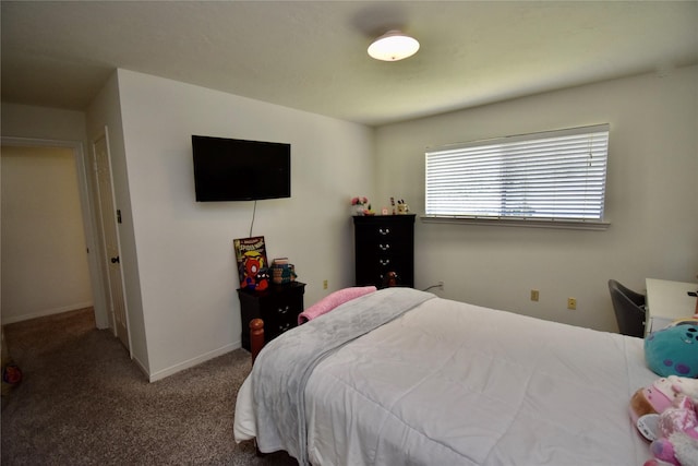 carpeted bedroom with baseboards