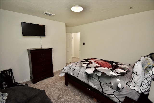 carpeted bedroom featuring baseboards