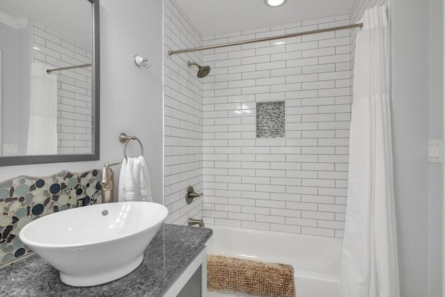 bathroom with shower / bathtub combination with curtain and vanity