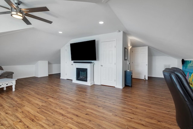 office space featuring a ceiling fan, wood finished floors, recessed lighting, and lofted ceiling