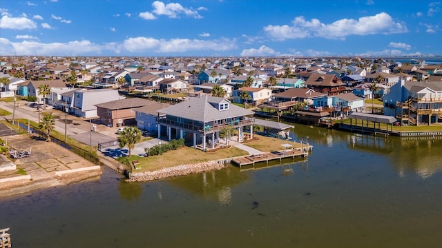 birds eye view of property featuring a water view and a residential view