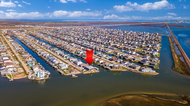 birds eye view of property with a residential view and a water view