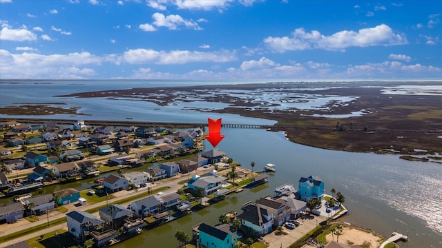 birds eye view of property featuring a water view and a residential view