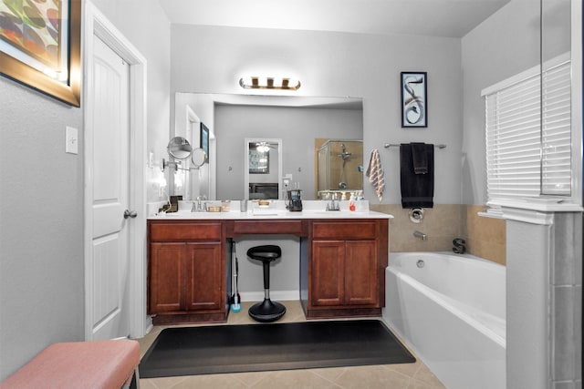 5305 Weeping Bow, Willis, TX 77378 - full bathroom featuring double vanity, a stall shower, tile patterned floors, a garden tub, and a sink