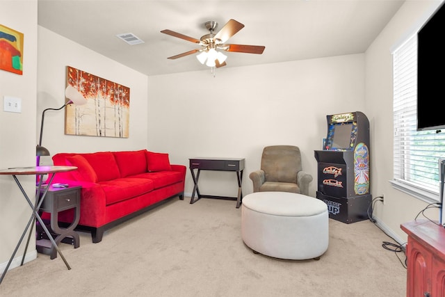 5305 Weeping Bow, Willis, TX 77378 - living area featuring carpet flooring, baseboards, a ceiling fan, and visible vents