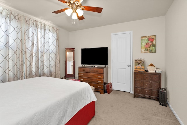 5305 Weeping Bow, Willis, TX 77378 - bedroom with ceiling fan, light colored carpet, and baseboards