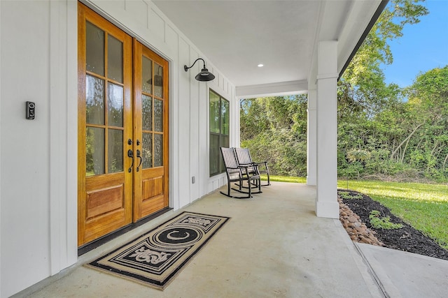 view of patio featuring french doors and a porch