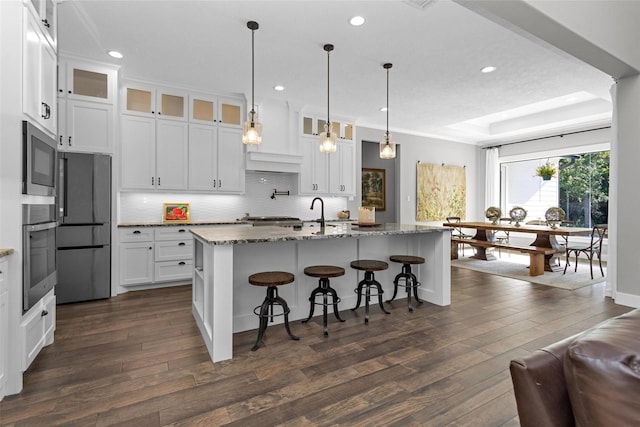 kitchen with oven, dark wood-style floors, built in microwave, and recessed lighting