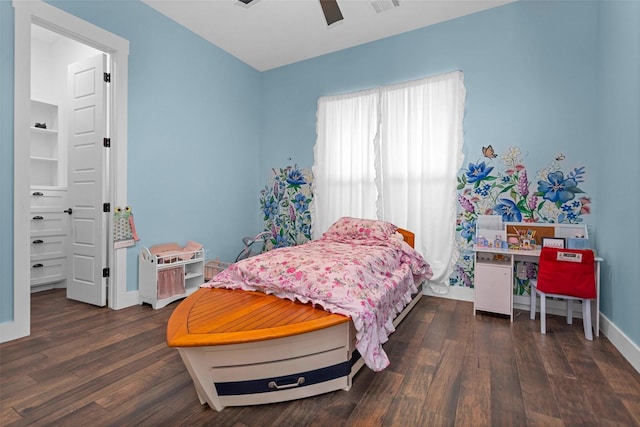 bedroom featuring wood finished floors, visible vents, baseboards, and ceiling fan
