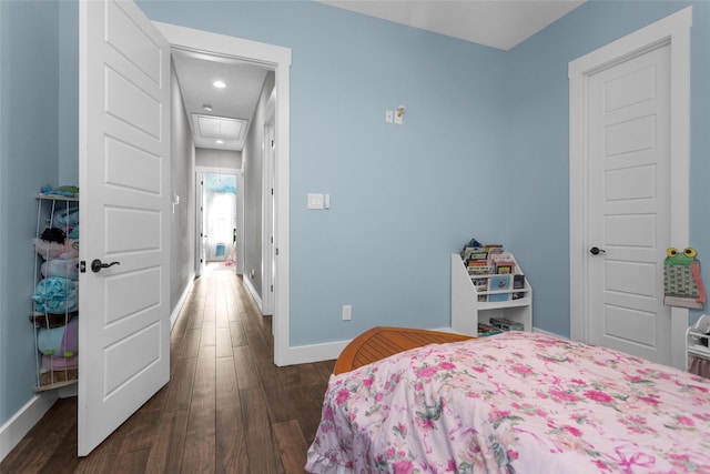 bedroom featuring dark wood-type flooring, baseboards, and recessed lighting
