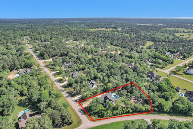 aerial view featuring a view of trees