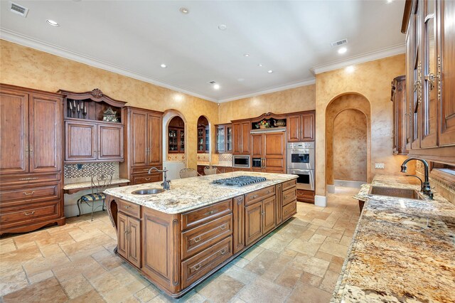 5530 Tilbury Dr, Houston, TX 77056 - kitchen featuring a sink, arched walkways, stone tile flooring, and visible vents