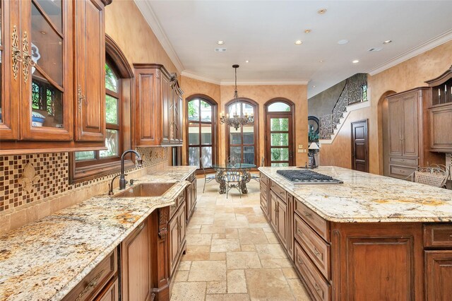 5530 Tilbury Dr, Houston, TX 77056 - kitchen with stone tile floors, recessed lighting, a chandelier, light stone counters, and a sink