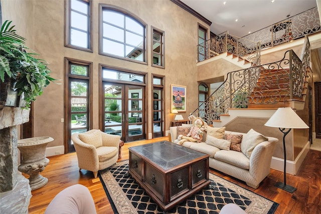5530 Tilbury Dr, Houston, TX 77056 - living area featuring stairs, wood finished floors, and a towering ceiling
