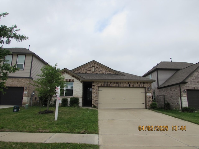 view of front of property featuring an attached garage, driveway, a front lawn, and brick siding