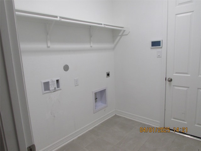 clothes washing area with laundry area, hookup for a washing machine, electric dryer hookup, gas dryer hookup, and baseboards