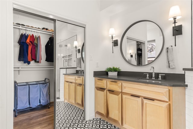 bathroom with vanity and wood finished floors