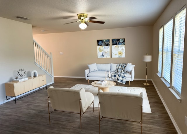 619 Mathis Mdw, San Antonio, TX 78251 - living room with stairs, wood finished floors, healthy amount of natural light, and a textured ceiling