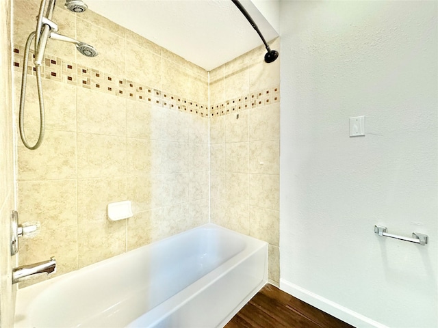 7914 Oakington Dr, Houston, TX 77071 - bathroom with wood finished floors, baseboards, and shower / tub combination