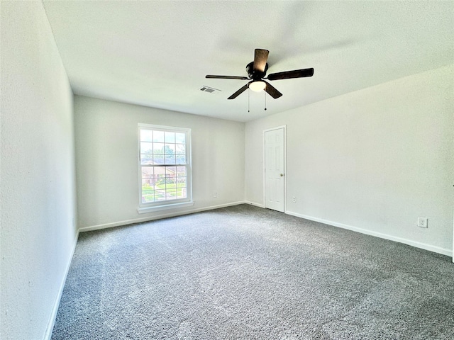 7914 Oakington Dr, Houston, TX 77071 - unfurnished room featuring dark carpet, a ceiling fan, and baseboards