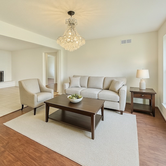 7914 Oakington Dr, Houston, TX 77071 - living area with a chandelier and wood finished floors