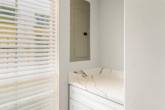 details featuring a textured wall and electric panel