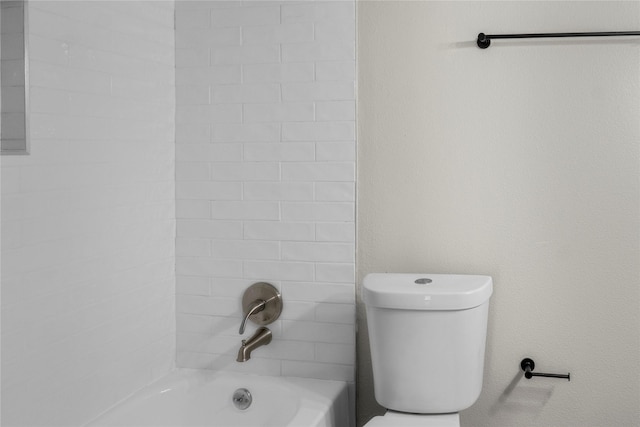 bathroom featuring toilet and shower / bathtub combination