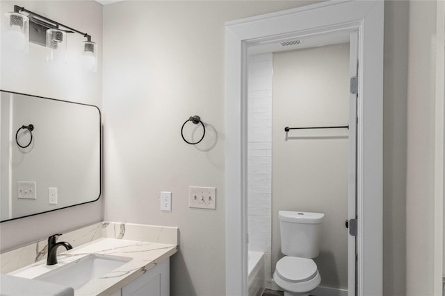 bathroom with visible vents, toilet, and vanity