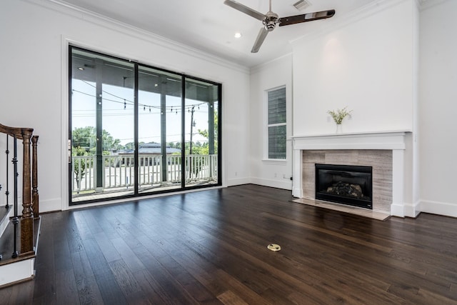 8624 Emnora Ln, Houston, TX 77080 - unfurnished living room with a ceiling fan, ornamental molding, wood finished floors, a tile fireplace, and baseboards