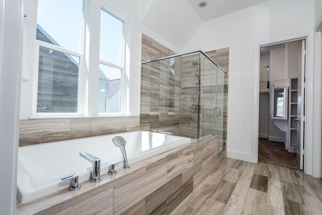 8624 Emnora Ln, Houston, TX 77080 - bathroom featuring a garden tub, a stall shower, a walk in closet, and vaulted ceiling