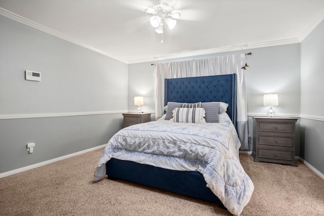 bedroom with ornamental molding, baseboards, a ceiling fan, and carpet