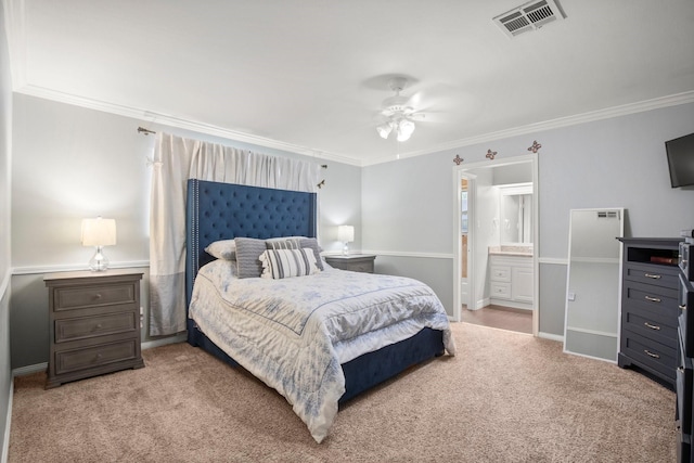 bedroom with crown molding, carpet flooring, visible vents, and connected bathroom