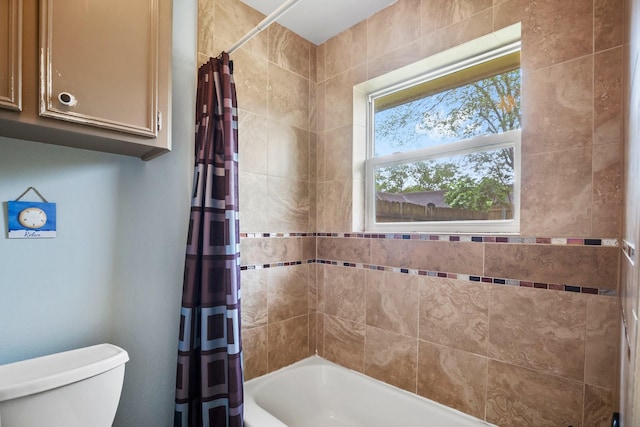 bathroom featuring toilet and shower / tub combo with curtain