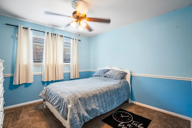 carpeted bedroom with baseboards and ceiling fan