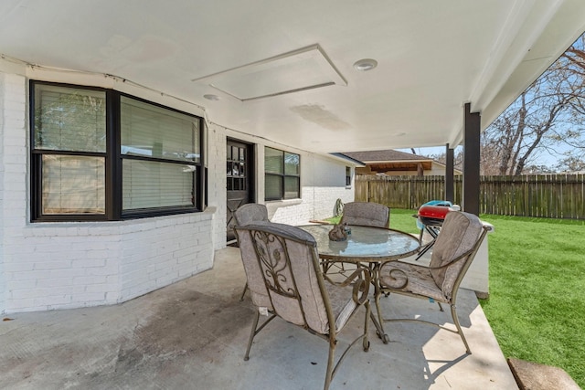 view of patio / terrace featuring outdoor dining space and fence