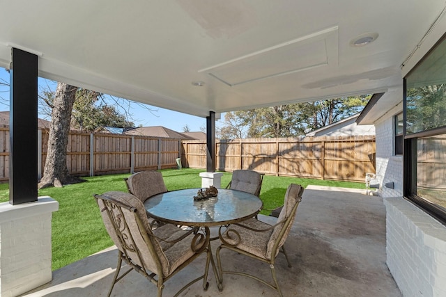 view of patio / terrace with a fenced backyard and outdoor dining area
