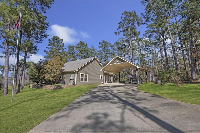 view of front of house featuring aphalt driveway and a front lawn