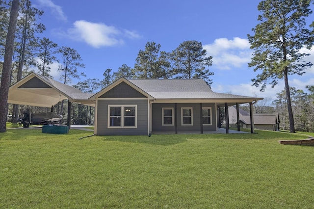 rear view of property with a yard