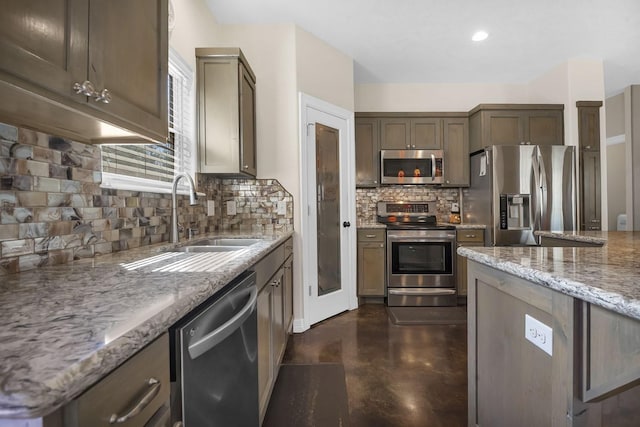 kitchen with concrete flooring, tasteful backsplash, light stone counters, and stainless steel appliances