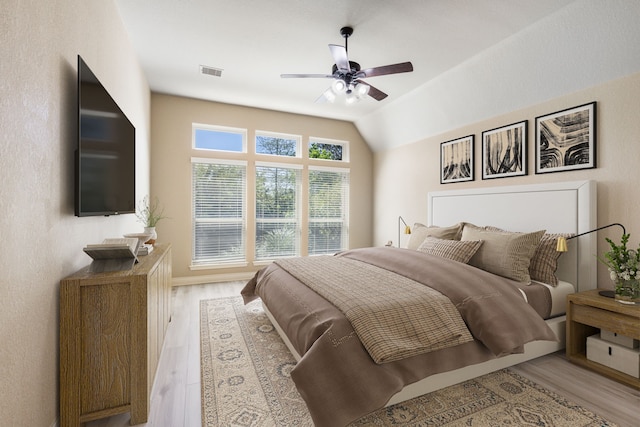 135 N Greatwood Glen Pl, Montgomery, TX 77316 - bedroom featuring light wood-type flooring and a ceiling fan