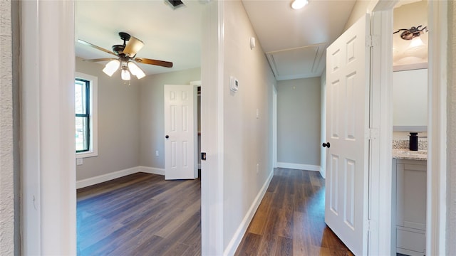 603 Maple Way, Houston, TX 77015 - hall featuring dark wood-style floors, baseboards, attic access, and visible vents