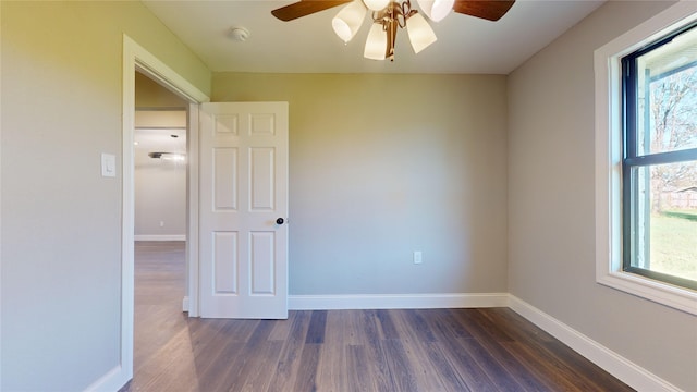 603 Maple Way, Houston, TX 77015 - spare room featuring dark wood-type flooring, baseboards, a ceiling fan, and plenty of natural light
