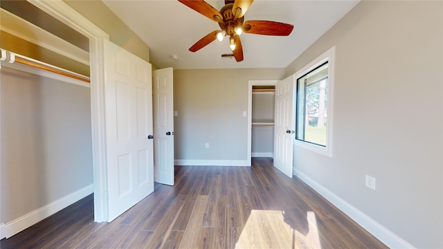 603 Maple Way, Houston, TX 77015 - unfurnished bedroom featuring dark wood-type flooring, a closet, baseboards, and a ceiling fan