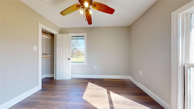 603 Maple Way, Houston, TX 77015 - unfurnished bedroom featuring baseboards, a ceiling fan, and dark wood finished floors