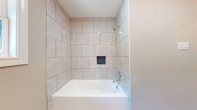 603 Maple Way, Houston, TX 77015 - bathroom with a textured wall and shower / bathtub combination
