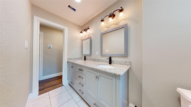 603 Maple Way, Houston, TX 77015 - bathroom featuring tile patterned floors, double vanity, visible vents, and a sink