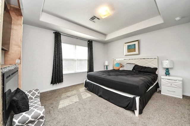 10330 Douglas Fir Villa Ave, Houston, TX 77044 - carpeted bedroom featuring a tray ceiling and baseboards